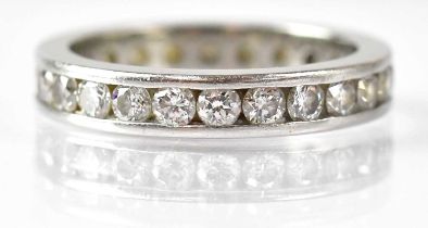 A platinum and diamond eternity ring set with diamonds, size M, approx. 5.7g.