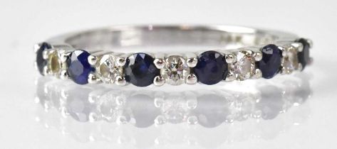 A 14k white gold ring set with sapphires and diamonds, size O, approx. 2.5g, with original receipt