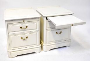 A pair of modern white painted bedside drawers, each with two drawers and top slides, 60 x 50 x 48cm