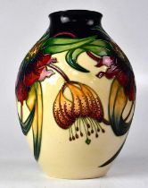 MOORCROFT; an 'Anna Lily' cream ground vase, copyright stamp to the base for 1998, height 20cm.