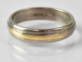 An 18ct white and yellow gold wedding band, size V, approx. 7.4g. Condition Report: The two rings