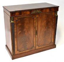 A reproduction mahogany hi-fi cabinet, the crossbanded top above pair of panelled doors, flanked