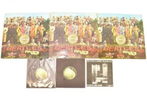 THE BEATLES; three copies of 'Sgt. Pepper's...', all with two EMI boxed logos, two with cardboard