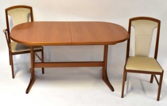 E. S. A. & MCINTOSH LTD; a mahogany dining room suite comprising oval extending dining table, with