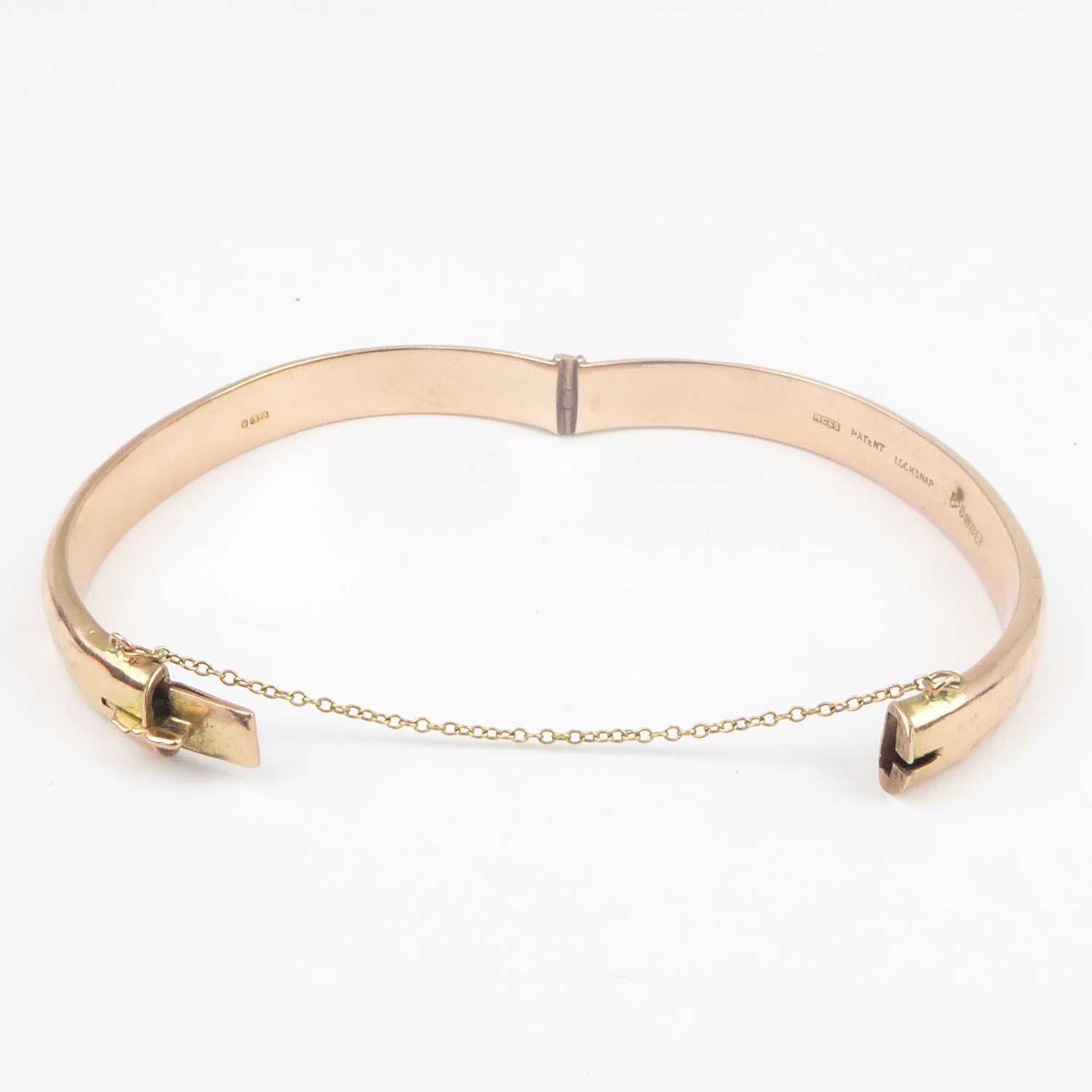 A 9ct rose gold hinged bracelet with safety chain, diameter 6.3cm, approx. 11g. Condition Report: - Image 3 of 3