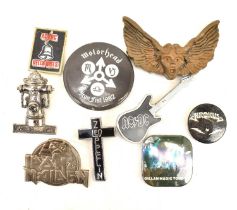 A collection of various vintage rock badges, to include Motörhead 1982, AC/DC, Iron Maiden, Gillan