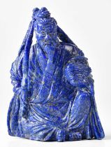A Chinese carved lapis lazuli figure of a seated Immortal, height 10cm.