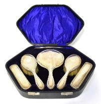 I. S. GREENBERG & CO; a George V hallmarked silver six-piece dressing table set, comprising comb