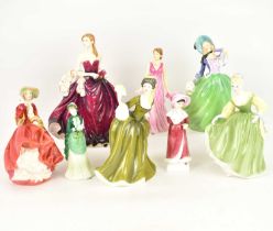 ROYAL DOULTON; seven porcelain figurines comprising HN5377 'Happy Birthday 2010', height 23.5cm,