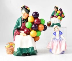 ROYAL DOULTON; three figures, HN1315 'The Old Balloon Seller', a miniature version HN2129, and a