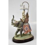 LLADRÓ; an 'Indian Princess Elephant' figure depicting a young lady on an elephant, raised on an