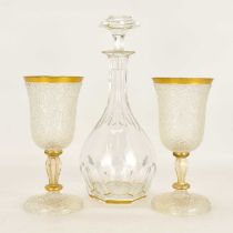 BACCARAT; a cut crystal decanter with cut gilt embellished stopper, rim, long lens cut neck and