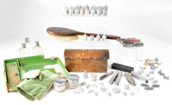 A collectors' lot comprising a vanity set, penknives, a wooden musical box, soapstone figures, etc.