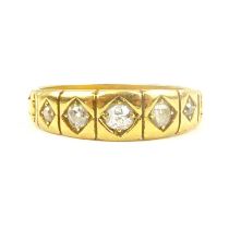 An 18ct gold ring with five flush set graduated small diamonds, size O, approx. 3.7g.