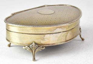 A George V hallmarked silver jewellery box, with engine turned decoration and blank cartouche to