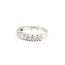 An 18ct white gold half eternity ring set with nine claw set small brilliant cut diamonds, size N,