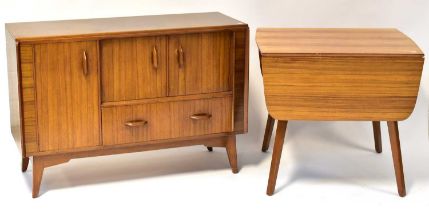 E. GOMME FOR G-PLAN; a retro stained mahogany sideboard, with pair of panel doors above single