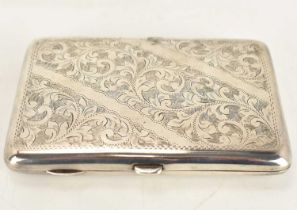 F D LONG; a George V hallmarked silver pocket cigarette case with floral decoration front and