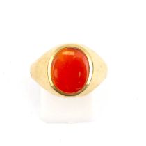 A 9ct gold signet ring with bezel set amber-coloured oval stone, size S, approx. 2.7g.