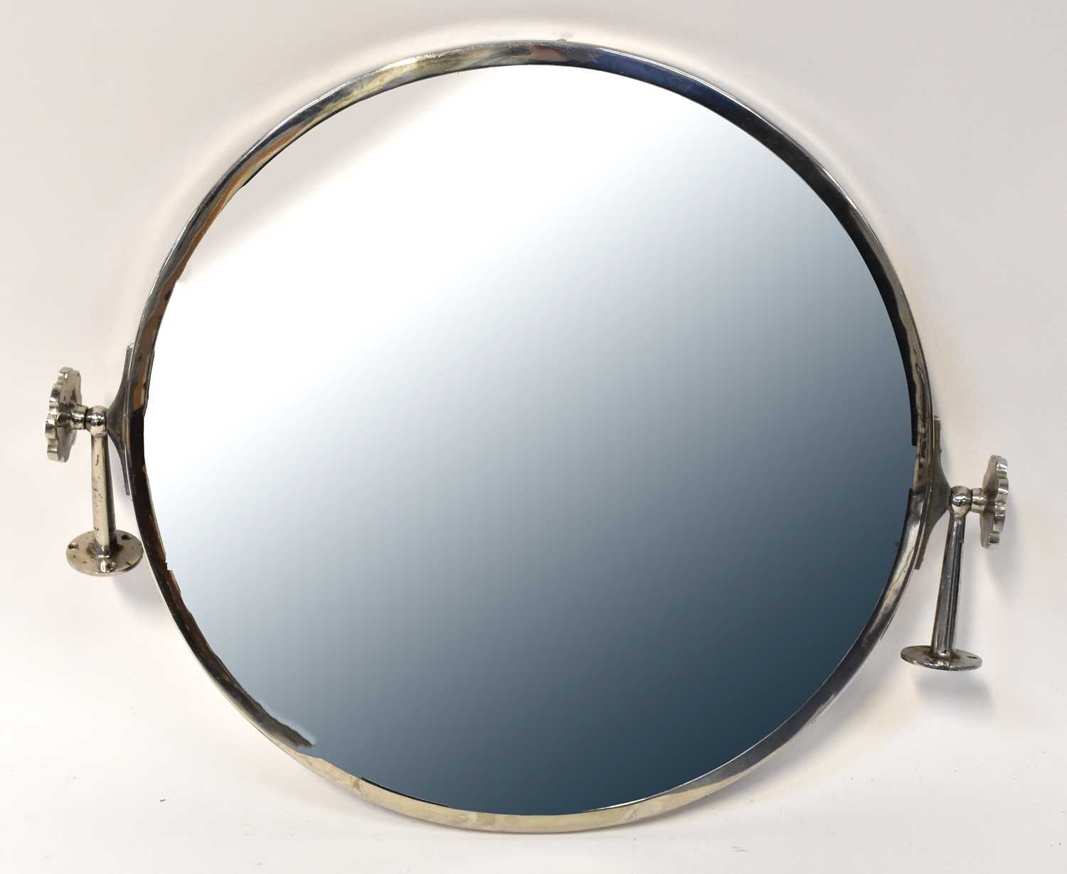 A circular wall mirror with bevelled plate and chrome swivel frame, 52 x 60.5cm, and a further Art - Image 2 of 2