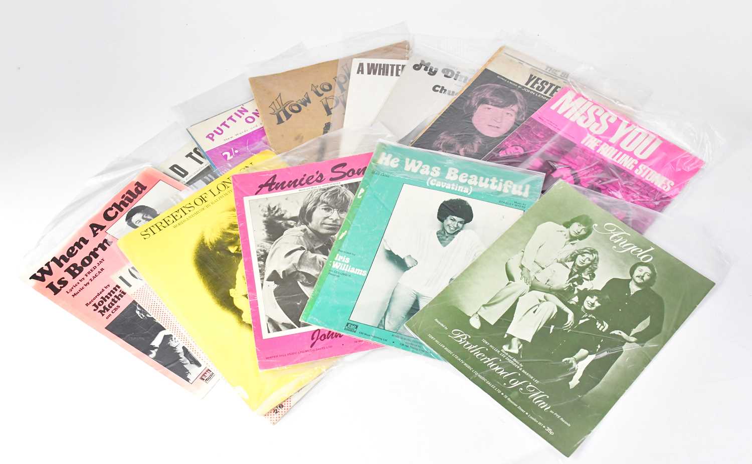 A quantity of sheet music to include The Beatles 'Yesterday', 'Let It Be', The Rolling Stones '