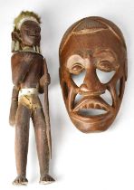 Four African carved wooden items comprising a mask, a bust with metal neck, jewellery and two