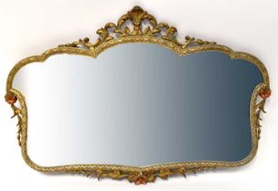 A gilt Rococo-style wall mirror with bevelled glass, floral and scroll detail, 58 x 86cm.