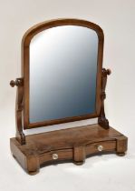 A Victorian mahogany swing toilet mirror on scroll supports, the base with a pair of jewellery