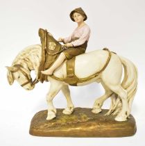 ROYAL DUX; a figure of a boy riding a shire horse, base impressed with number 1693, height 37cm (