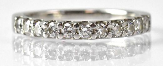 A platinum and diamond half eternity ring, size O, approx. 3.5g, with Beaverbrooks certificate and