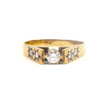 A 9ct gold ring with cathedral set small brilliant cut diamond, approx. 0.18ct, flanked by two