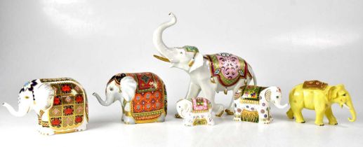 ROYAL CROWN DERBY; four paperweights in the form of elephants, one being exclusive to Mulberry