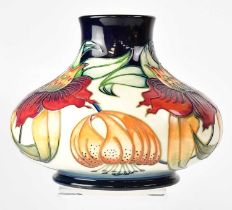 MOORCROFT; a cream ground squat baluster vase in the 'Anna Lily' pattern by Nicola Slaney, height