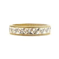 A 9ct gold eternity ring set with tiny diamonds, approx. 0.2ct, size L, approx. 3.2g.