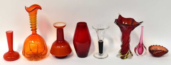 Seven studio glass vases, mainly orange and red, including cased and Murano-style examples, height