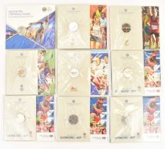 THE ROYAL MINT; nine 'Commonwealth Games' 50p brilliant uncirculated coin packs comprising '