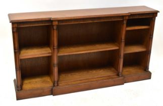 A reproduction mahogany break-front bookcase of small proportions, 84 x 160 x 30cm.