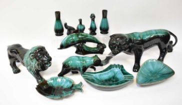 Twelve Canadian Blue Mountain Ceramics items, to include a large model of a lion, a bear, a dolphin,