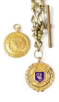 A 9ct gold fob in the form of a medallion, with central shield bearing a stag and four shells with