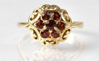 A 9ct yellow gold garnet cluster ring, size U, approx. 3.2g