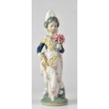 LLADRÓ; a Valencia figure of a young lady with a bunch of flowers, height 24cm. Condition Report: