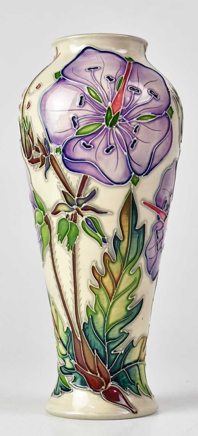 MOORCROFT; a 'Meadow Cranesbill' pattern cream ground vase, signed and dated to base '4.5.2002',