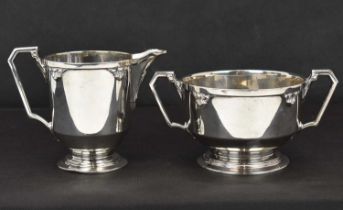 WILLIAM COYMS & SONS; a George V hallmarked silver Art Deco style sugar bowl, diameter 16cm, and