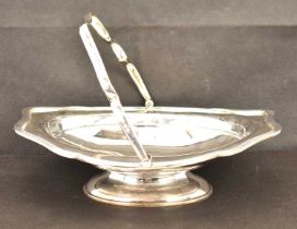 MARTIN, HALL & CO; a George V hallmarked silver basket with swivel shaped handle, oval body with