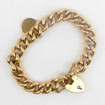 A 15ct gold belcher link bracelet with small swivel pendant, and a 15ct gold heart-shaped padlock