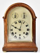 A contemporary mahogany cased dome topped eight-day Westminster chiming mantel clock, the silvered