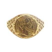 A 9ct gold signet ring set with small Mexican coin to open basket shoulders, size N, approx. 2.8g.