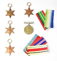 A group of WWII medals, comprising a British War Medal, a 1939-45 Star, an Atlantic Star, a