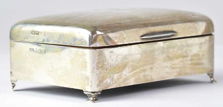 JAMES WALTER TIPTAFT; a George V hallmarked silver cigarette box, the lid with engine turned