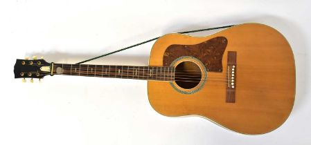 A six-string acoustic guitar, overall length 104cm.